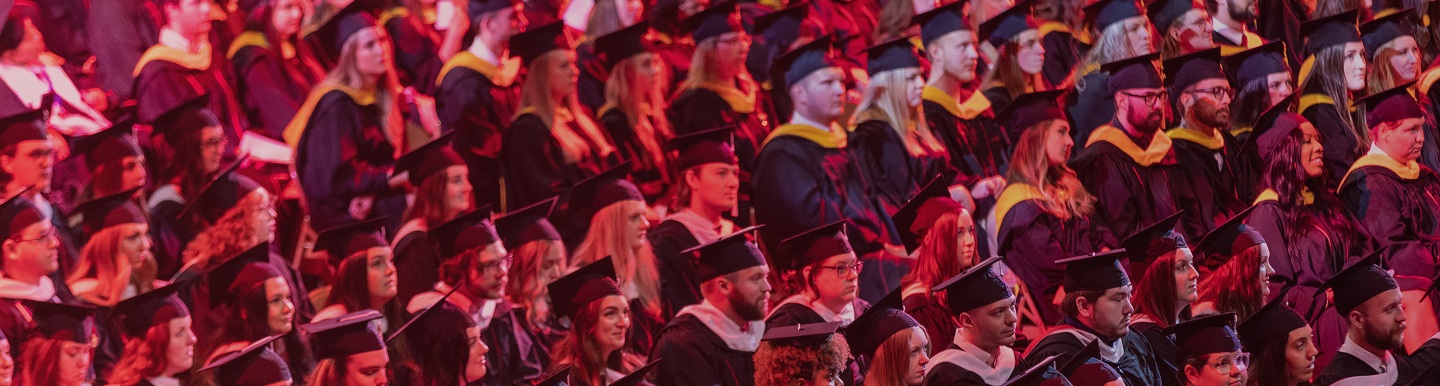 students sitting on graduation ceremony